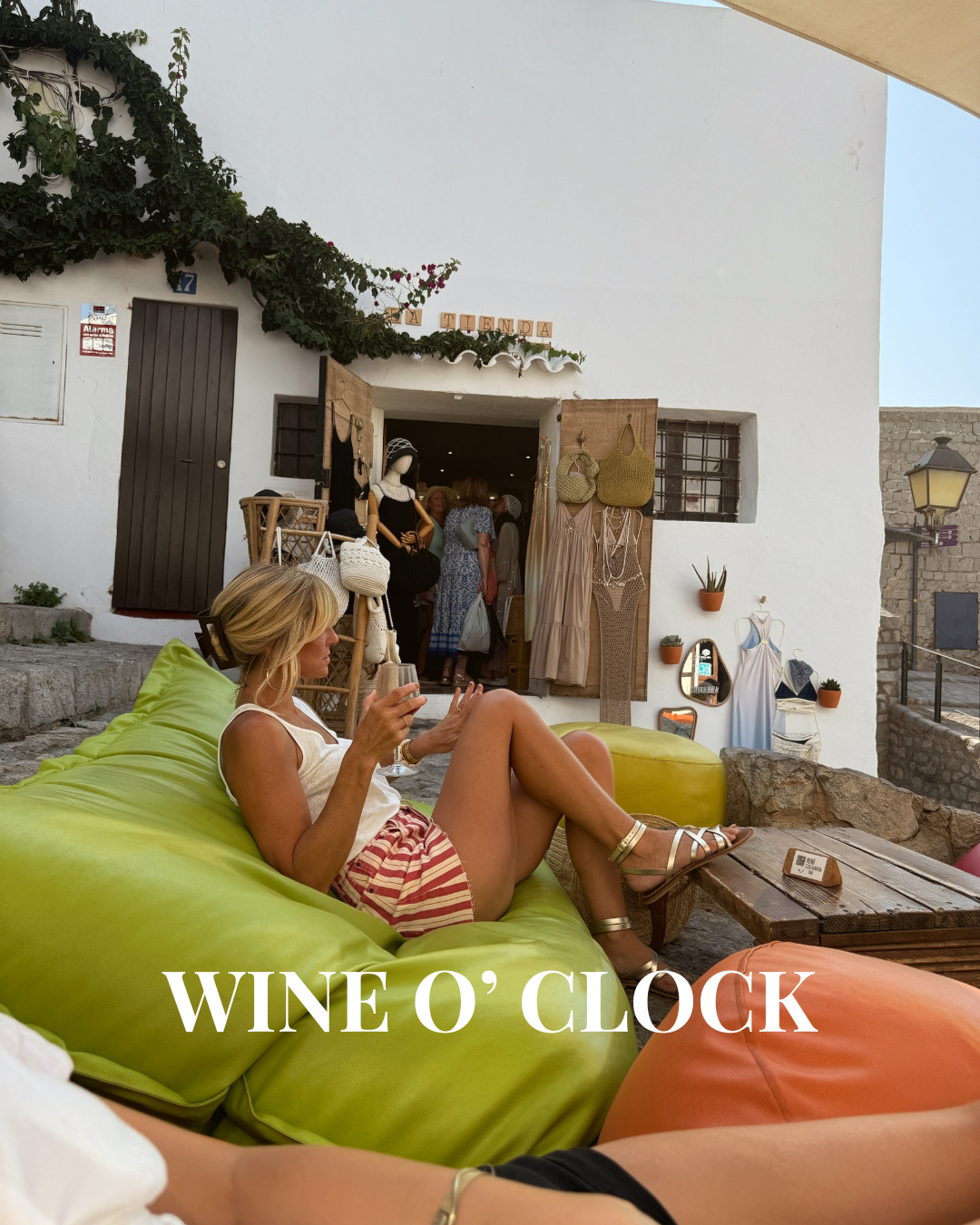 Wine o'clock in striped shorts on a hot Ibiza evening