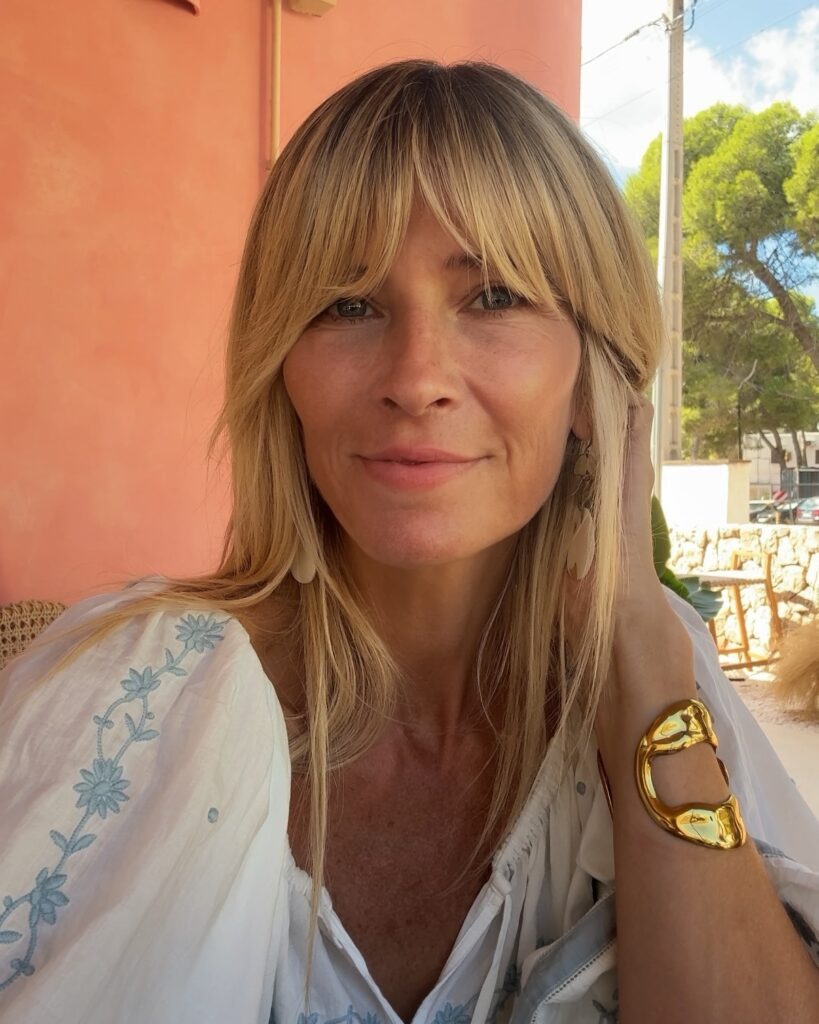 White embroidered blouse and gold cuff bracelet at Stoop Café, Ibiza