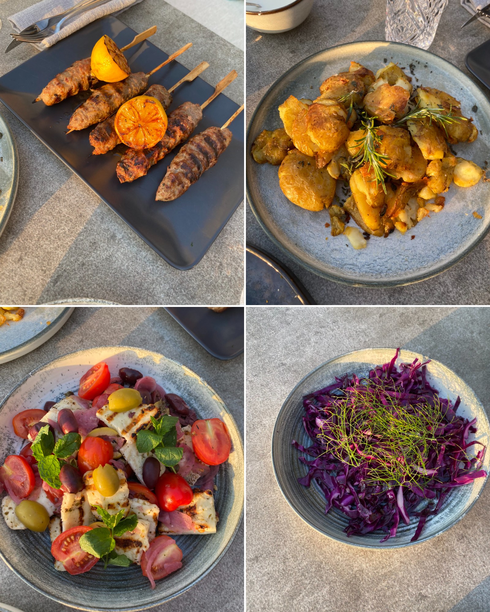 Soul Bowl sharing feast — lamb kebabs, roast potatoes, halloumi salad and red cabbage & dill salad